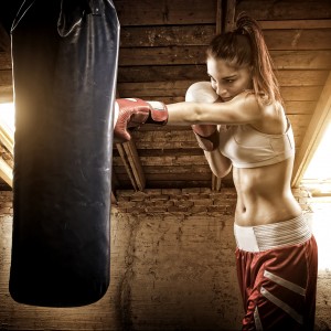 Young woman boxing workout on the attic